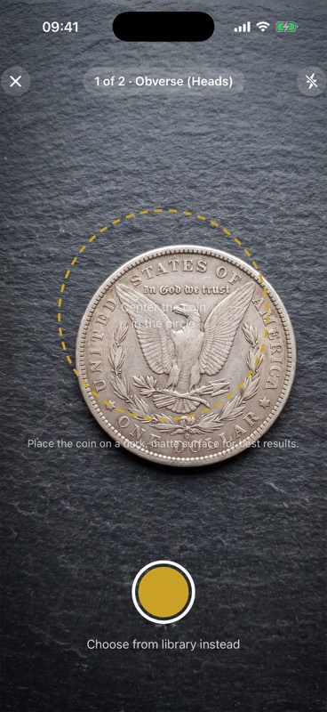 CoinSage camera screen framing a Morgan dollar inside a golden guide circle
